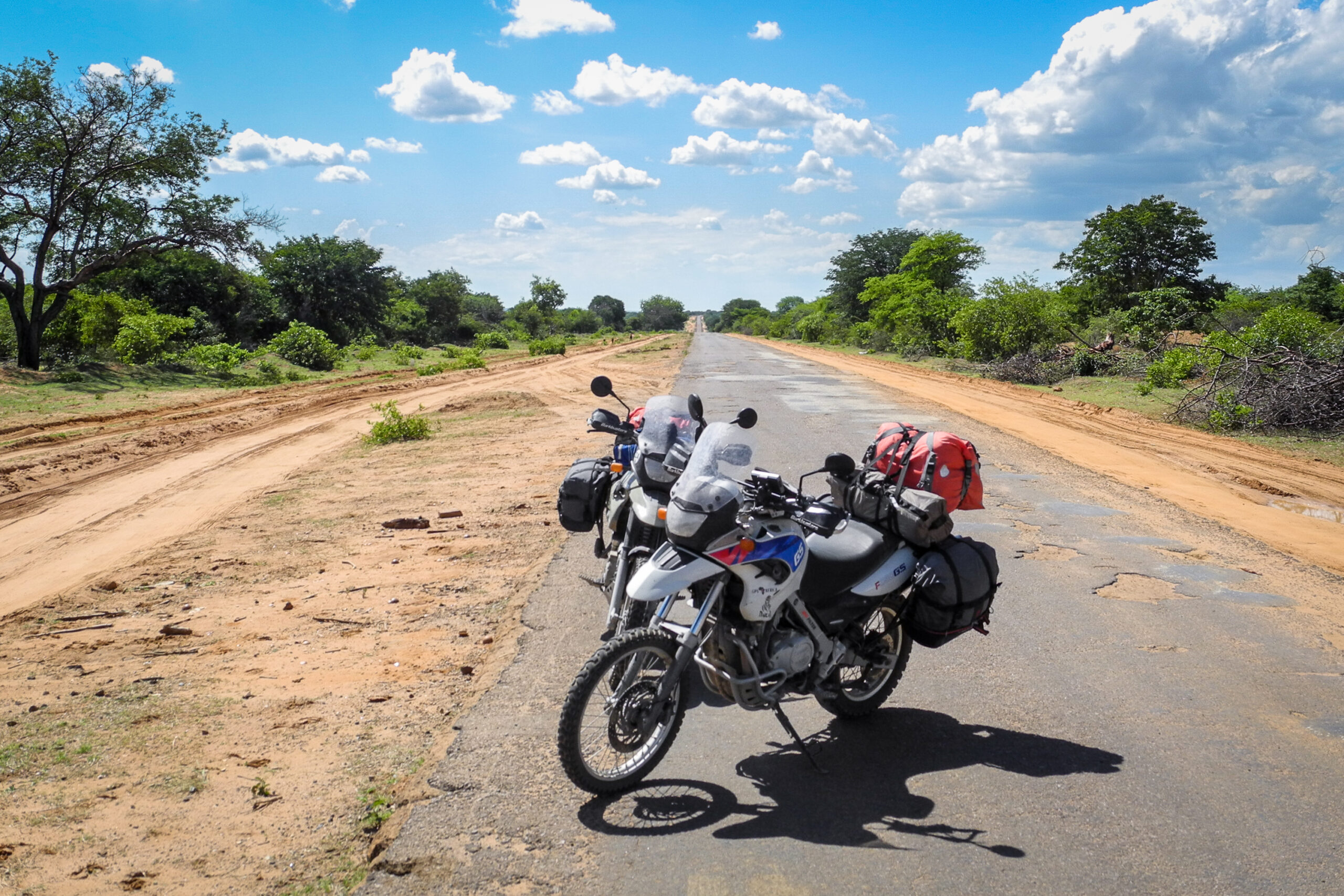 Pothole roads in Angola. It will kill any motorcycle wheels and suspension in quick time. Moto enduro stuff