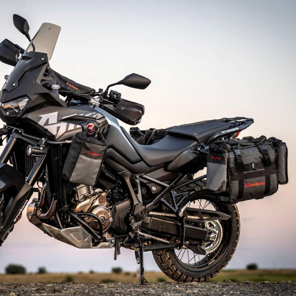 Honda Africa Twin motorcycle with Turkana HippoHips 20L soft panniers mounted using plate kit