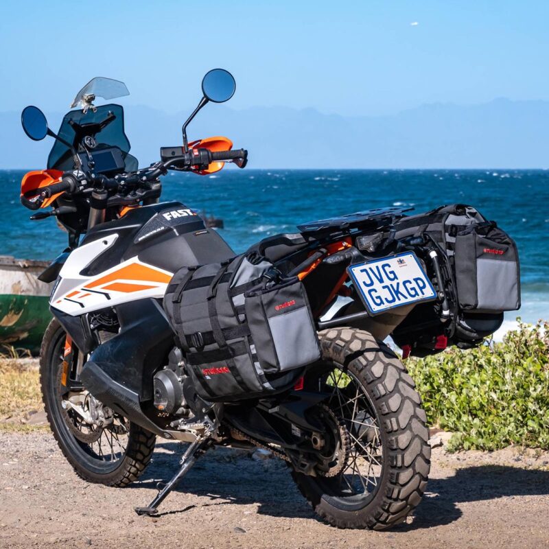 Turkana HippoHips soft pannier mounted on KTM Adventure bike with BushBaby bag attached to MOLLE system