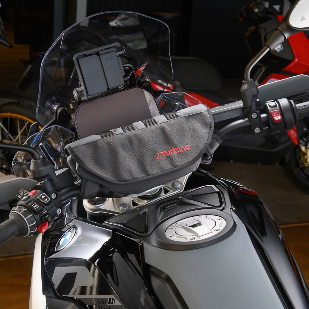 Turkana Gear PelliPouch Premium handlebar bag on a BMW GS, showing padded storage and RhinoCote ripstop construction for adventure and off-road riding.