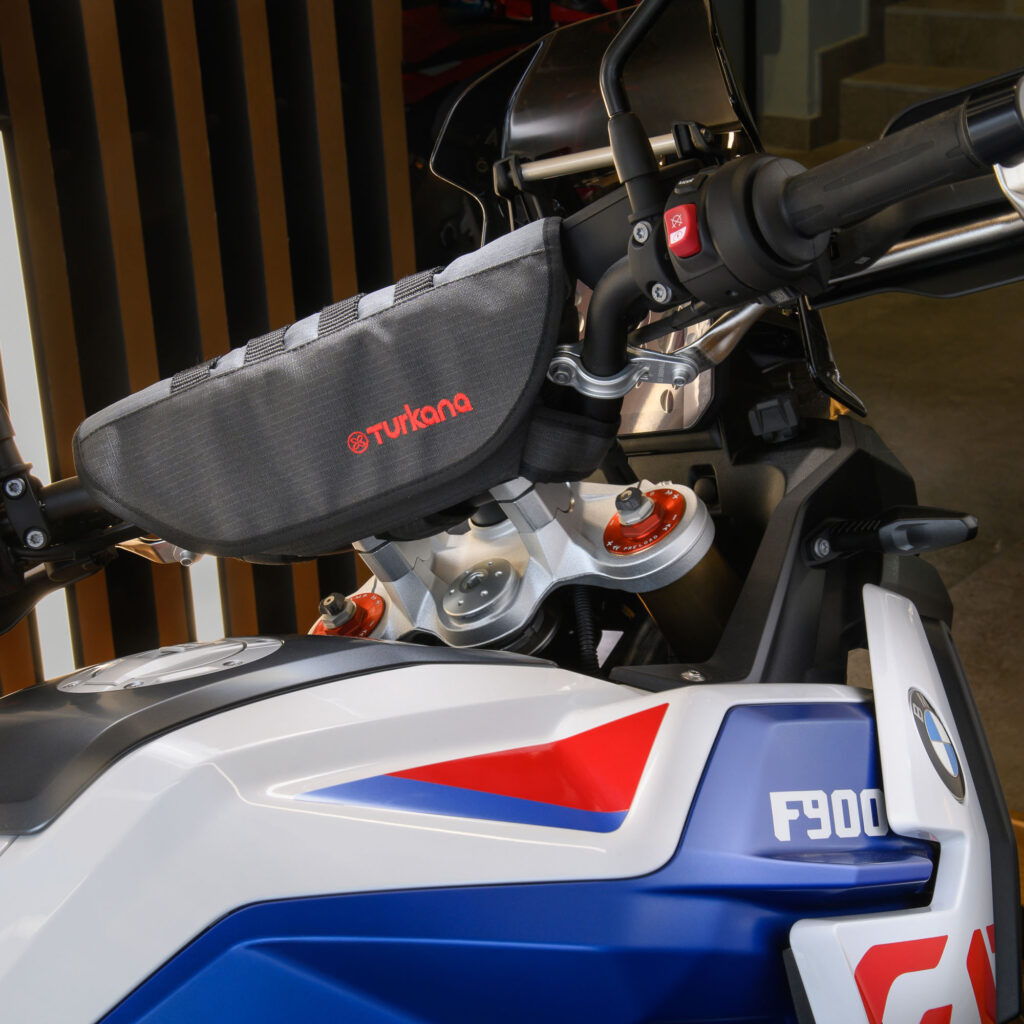 PelliPouch Premium by Turkana Gear mounted on a BMW F900, highlighting the padded design, MOLLE webbing and durable RhinoCote outer for ADV and off-road use.