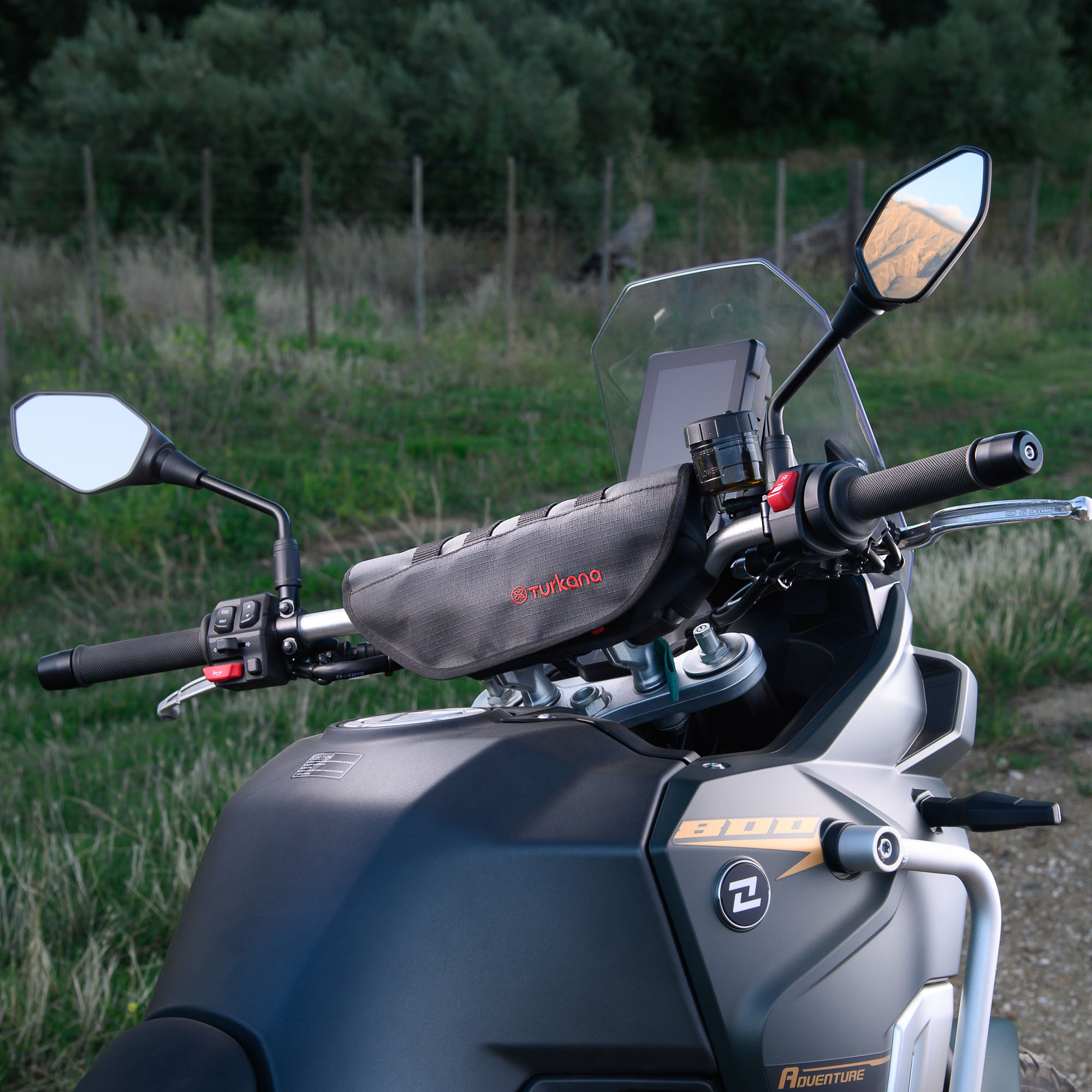Turkana Gear PelliPouch Premium handlebar bag fitted to a Kove 800 adventure bike, showing padded design, RhinoCote ripstop fabric and universal mounting straps for off-road and touring use.