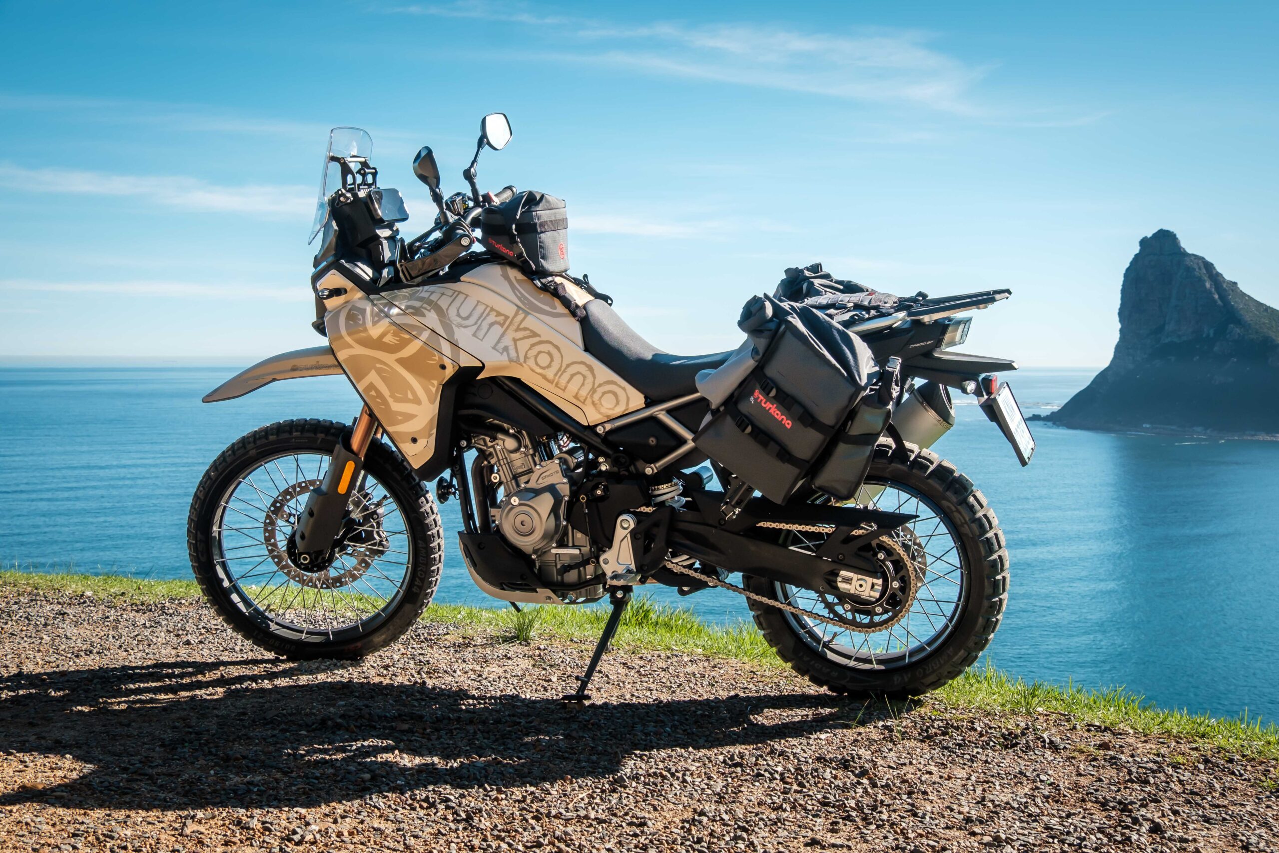 CFMoto 450 with Turkana MadMules and Bullfrog tank bag on dirt trail