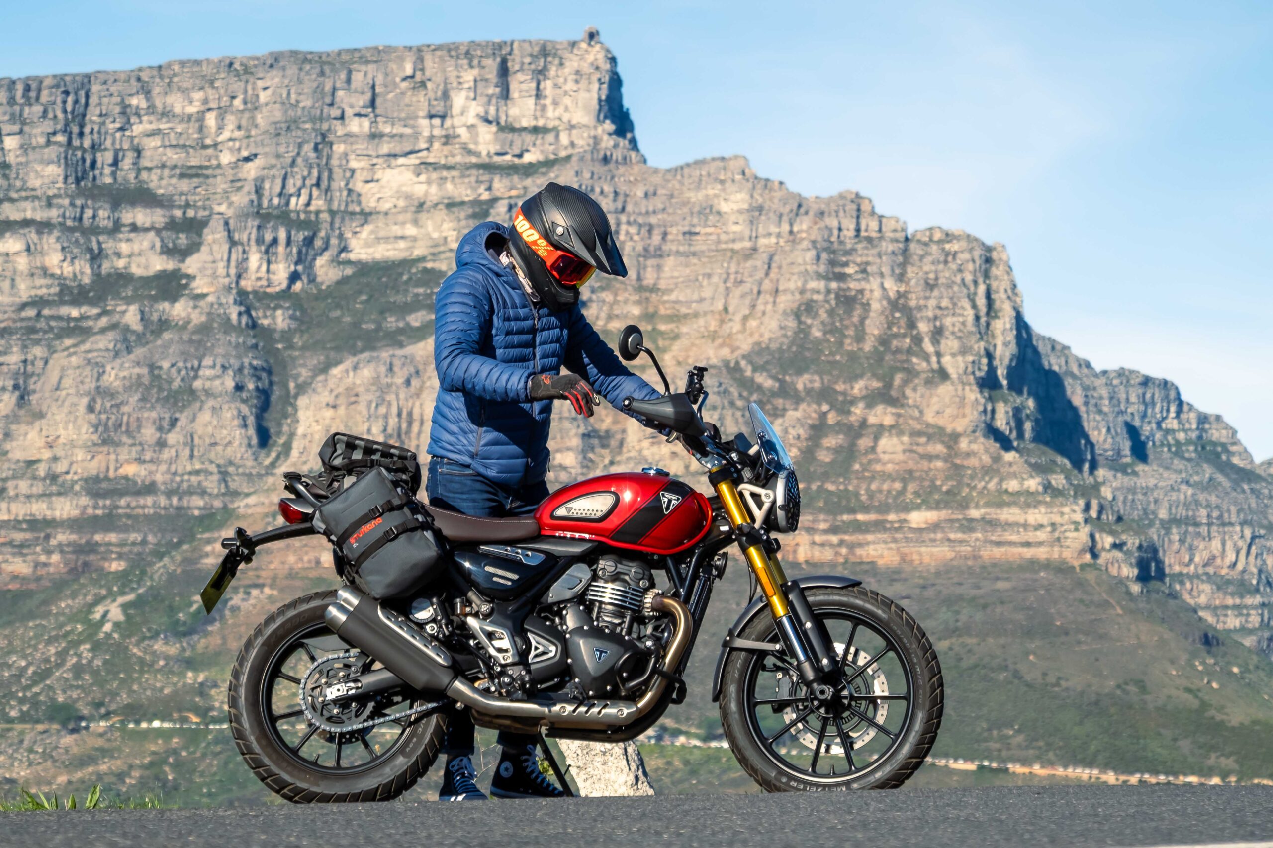 Triumph Scrambler 400X with Turkana MadMules soft luggage on a mountain pass near Cape Town
