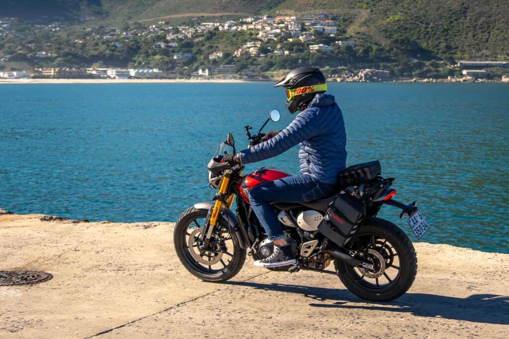 Triumph Scrambler 400X with Turkana soft panniers riding gravel road