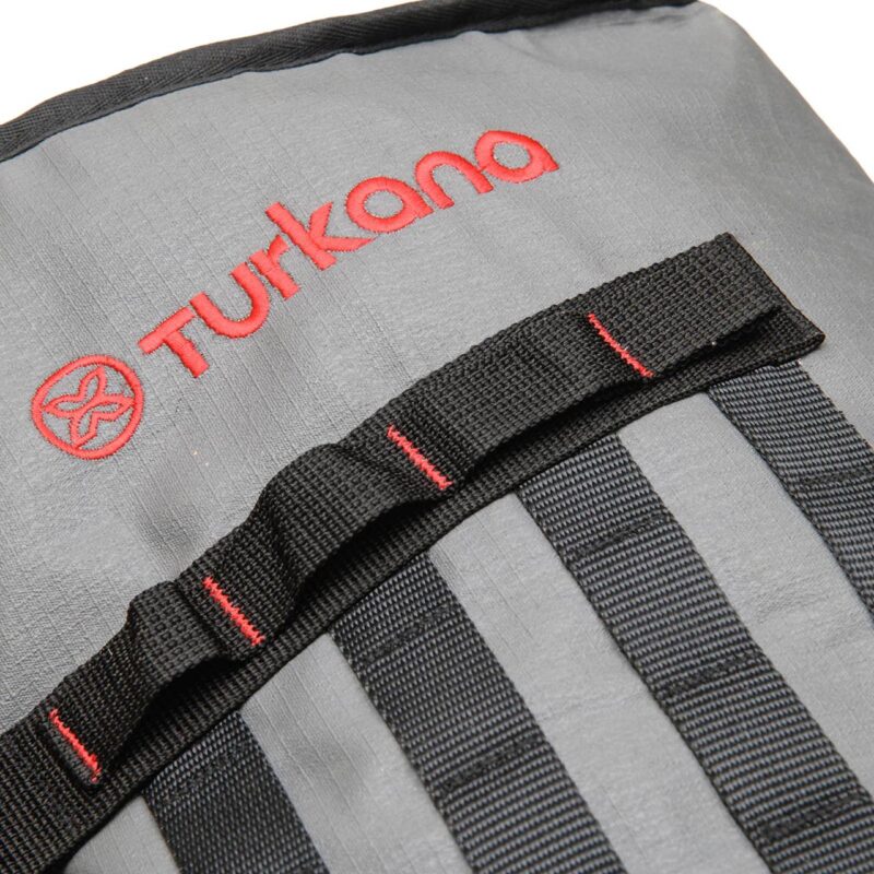 Close-up of Turkana Duffalo duffel bag showing reinforced carry handle, webbing straps, and heavy-duty buckle.