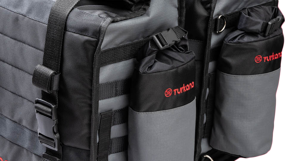 Close-up of Turkana HippoHips saddlebag with Oxpacker pouches mounted to the M.O.L.L.E. webbing.