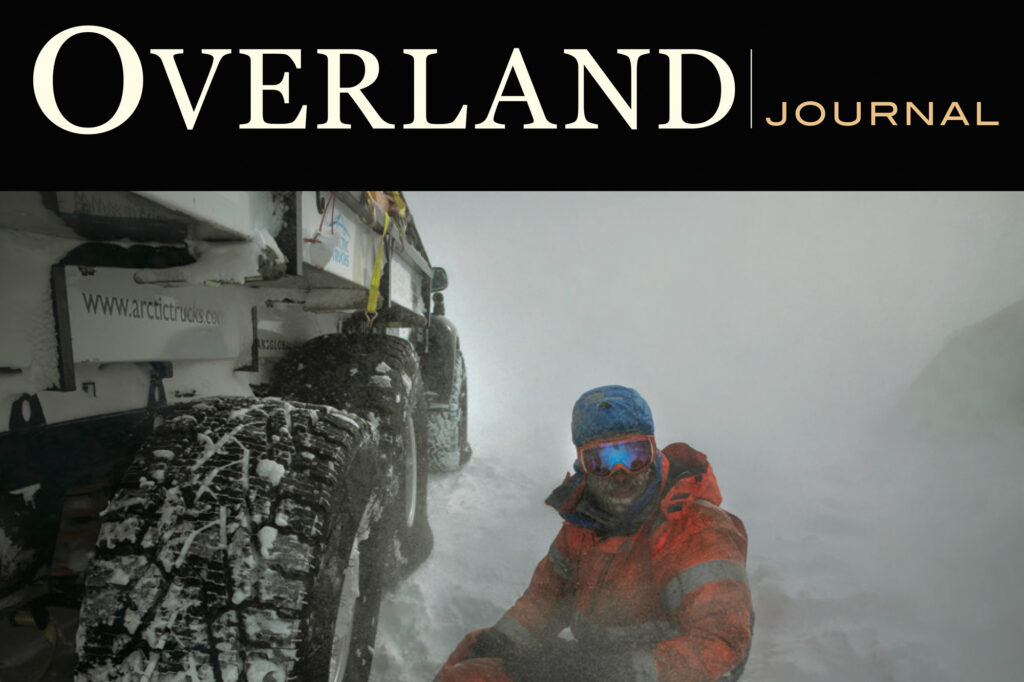 A two-page spread in Overland Journal highlights Turkana Gear’s storage range. The article, written by overlander Luisa Bell, praises the brand’s South African-made gear, emphasizing durability, real-world testing, and quirky personality. Product photos show the Magpie EDC bag open with compartments, the ChipCheeks packing cubes, and the Sloth Utility Bag, alongside detailed write-ups on each product’s features and uses.