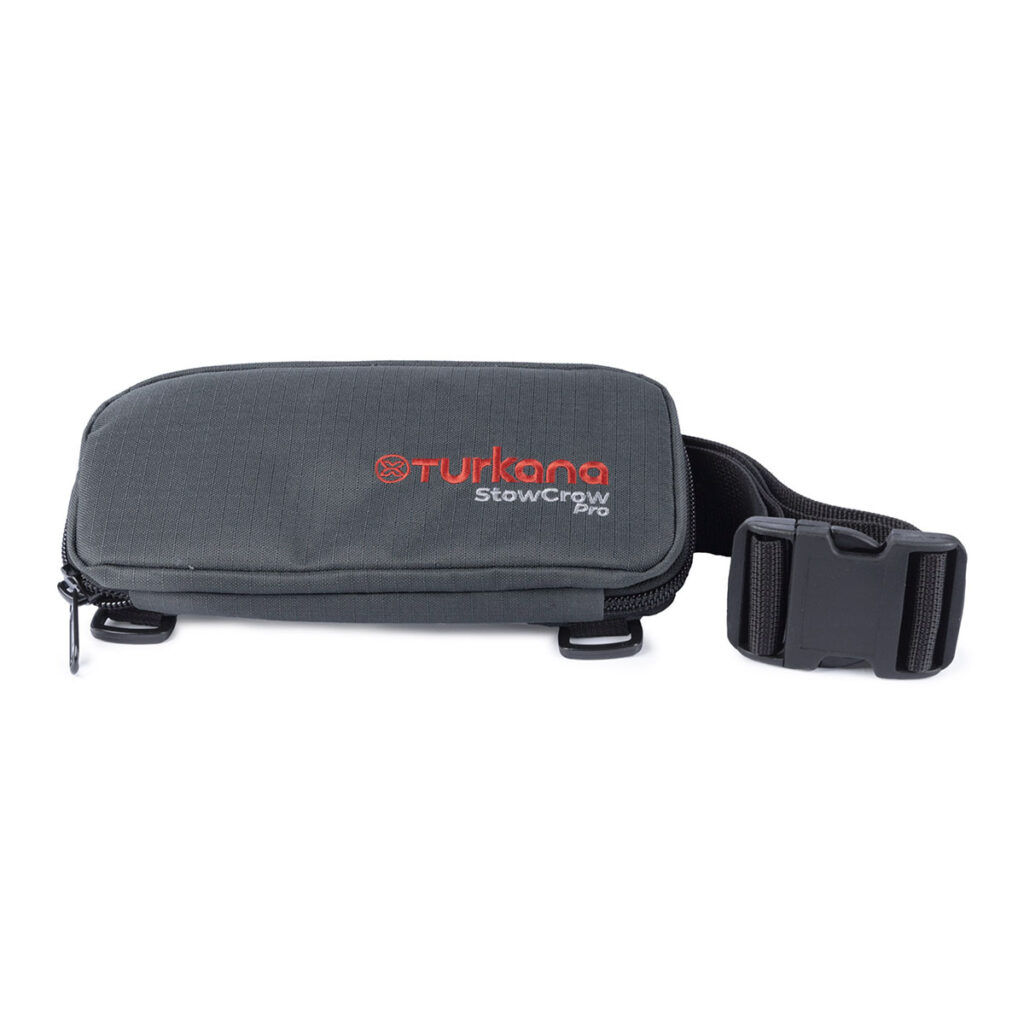 Turkana StowCrow Pro closed tool pouch strapped to motorcycle rack, compact and travel ready. Removable waist strap