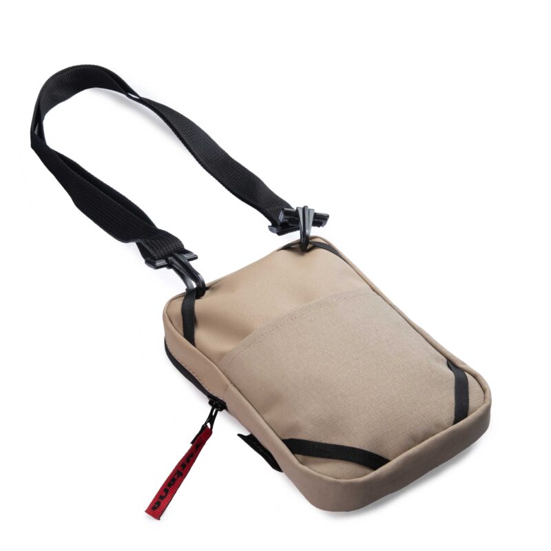 Back view of the Turkana SlingThing showing the outer stash pocket and attachment loops with the shoulder strap clipped to the top corners.