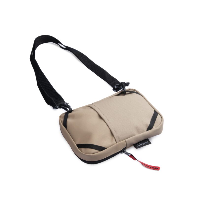 Turkana SlingThing pouch laid flat showing the back stash pocket and minimal profile.