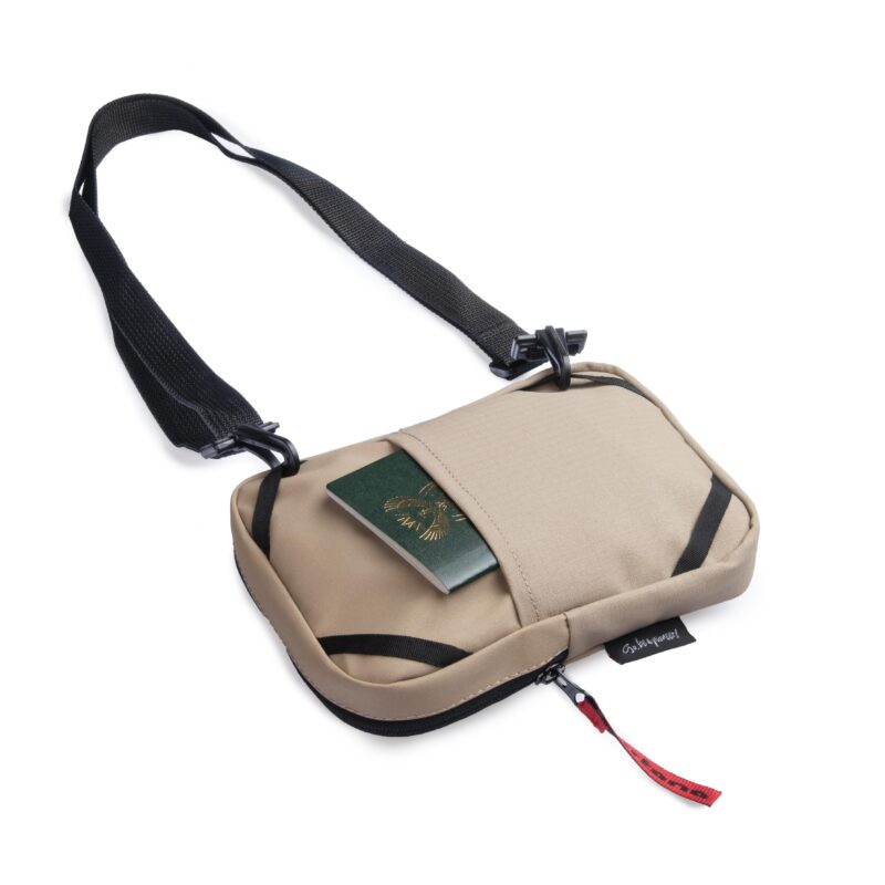 Turkana SlingThing pouch with a passport placed in the back stash pocket.