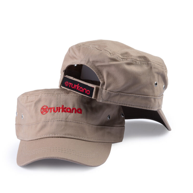 Turkana DustDevil Cap in tan with red embroidered logo, military style foldable design.