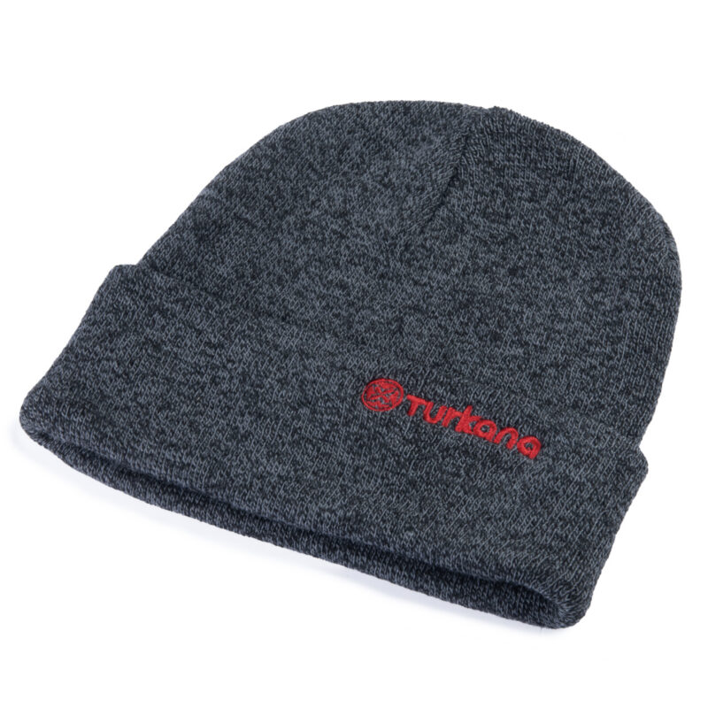 Dark grey Turkana NUtshell™ knitted beanie with red embroidered logo on folded cuff, angled side view