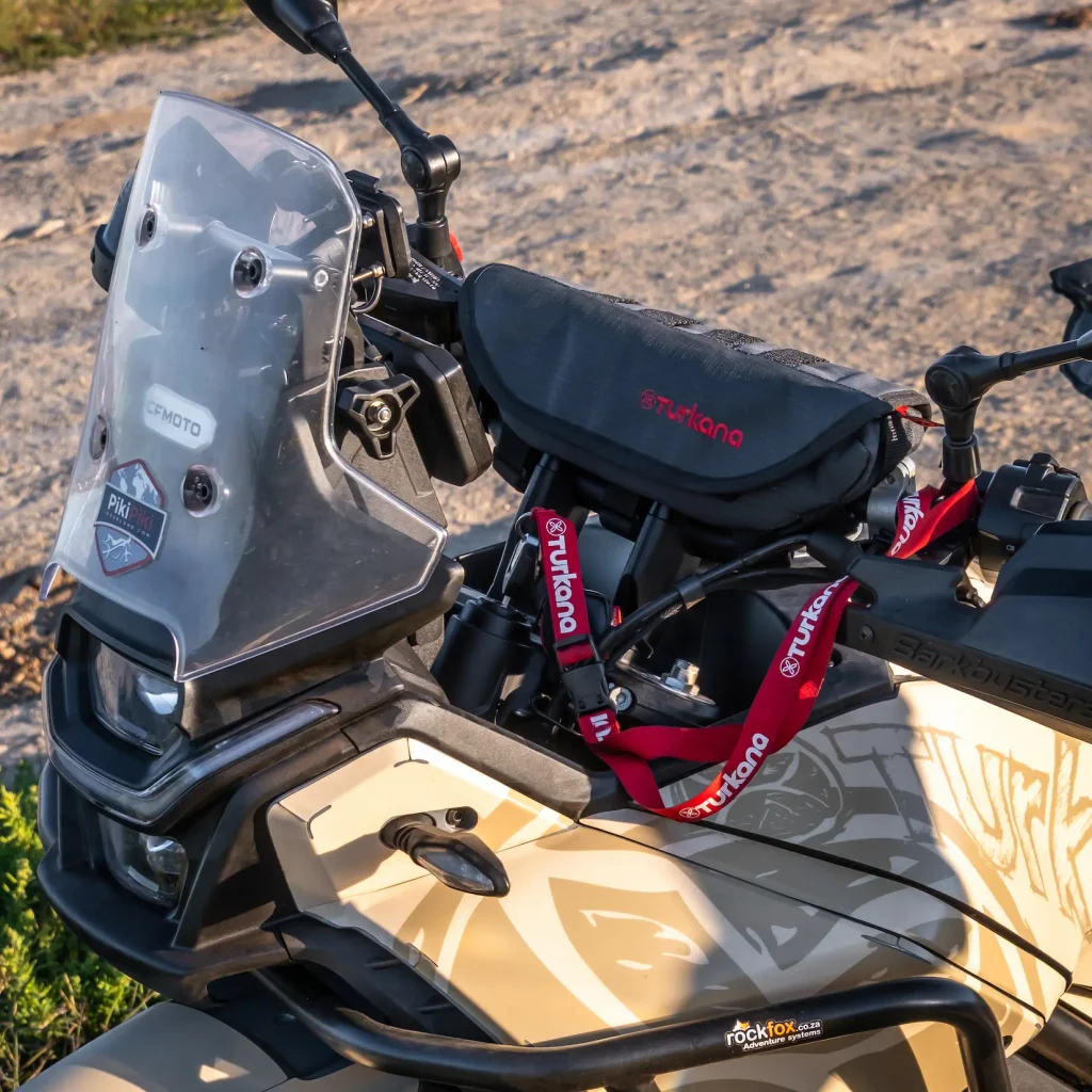 Turkana PelliPouch Enduro mounted on the handlebars of a CFMOTO adventure motorcycle.