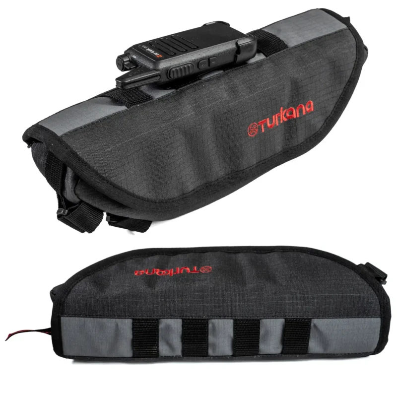 MOLLE loops on the PelliPouch Enduro motorbike lid holding a compact two-way radio.